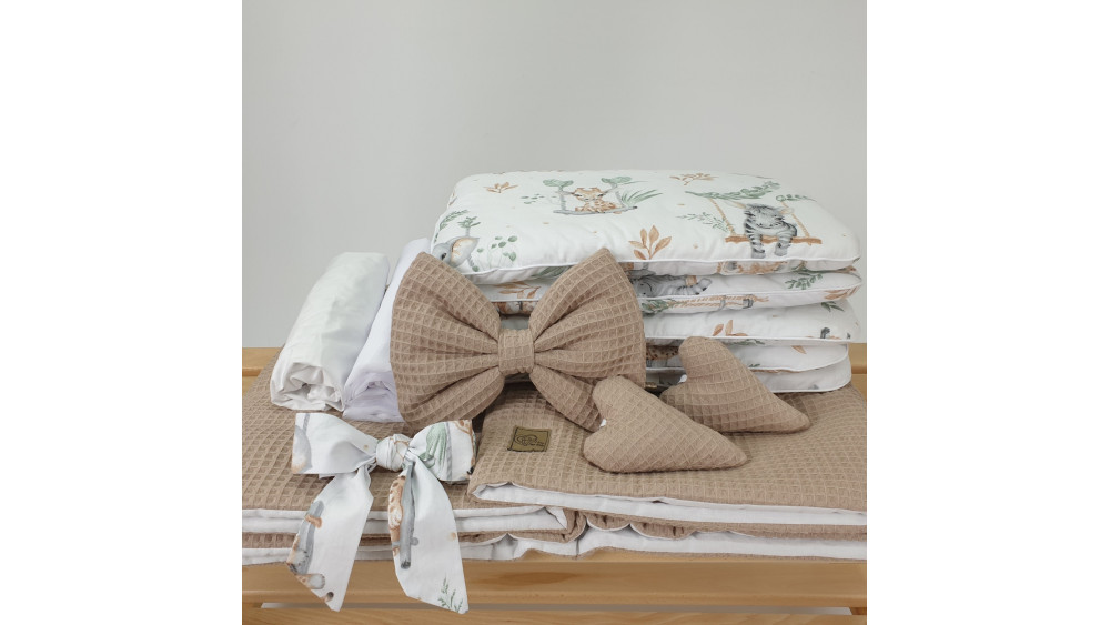 Kosz Mojżesza detal pościeli beżowy wafel z brązową kokardą